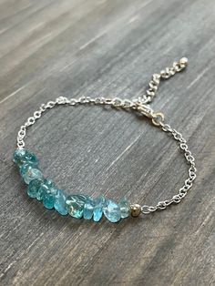 This bracelet is made with natural blue apatite chips and silver-toned chain. It also has a 1.5 inch adjustable chain, making the bracelet anywhere from 6.5 to 8 inches in order to create a perfect fit for the user.  *Because this jewelry is made of natural gemstones, please allow for small variations in gemstone size, color, and texture. However, every effort will be made to have the product accurately match the image shown on the listing Shipping Information ---------------------- This jewelry Gemstone Chips Bracelet, Apatite Jewelry, Chip Bracelet, Natural Stone Jewelry, Blue Apatite, Bracelets Handmade Beaded, Bracelet Handmade, Gemstone Bracelets, Chicago Il