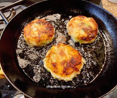 three cooked food items cooking in a frying pan on top of a gas stove