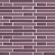 a close up view of a purple glass tile backsplash with white strips on it