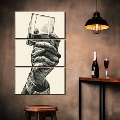 a man holding a glass of wine in his hand on a wall above a bar