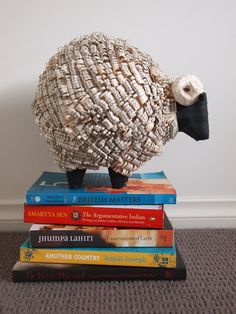 a sheep made out of books sitting on top of each other