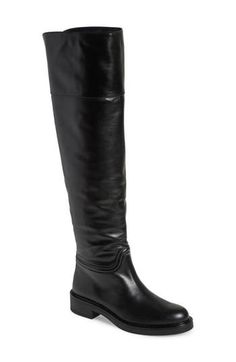 A classic riding boot takes a dramatic turn with smooth leather composition and an over-the-knee silhouette. 1 3/4" heel 20 1/2" shaft; 14" calf circumference Pull-on style Leather upper/synthetic lining and sole Made in Spain Classic Knee-high Boots In Calf Leather, Classic Wide Calf Knee-high Boots In Calf Leather, Classic Calf Leather Wide Calf Knee-high Boots, Classic Knee-high Riding Boots For Fall, Fitted Knee-high Riding Boots, Classic Wide Calf Knee-high Boots For Riding, Riding Knee-high Boots With Leather Sole, Elegant Over The Knee Calf Leather Boots, Elegant Over-the-knee Calf Leather Boots