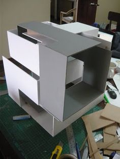 an unfinished cabinet being built on top of a table