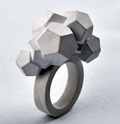 a ring made out of concrete sitting on top of a table