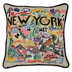 a pillow with the words new york written in many different languages and colors on it