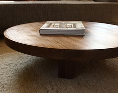 a coffee table with a book on top