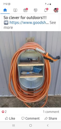 an orange hose connected to a metal container