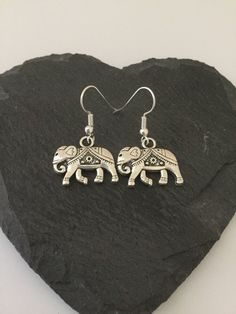 Cute elephant earrings. 21mm adorable Tibetan silver elephants fitted with 20mm zinc alloy hypoallergenic fish hook earring wires. Lead and nickel free. These sweet earrings will make a very special gift for any animal loving lady or a wonderful treat for yourself. Matching necklace available. Shipped in a pretty satin gift bag. Estimated shipping times - Business days : North America 5-15 Europe 5-15 Australia / New Zealand  7-21 United Kingdom  1-3 Please note that due to brexit, some overseas orders are subject to customs delays at the destination. Elephant Jewelry, Ceramic Elephant, Sweet Earrings, Elephant Earrings, Silver Elephants, Elephant Lover, Earring Wires, Fish Hook Earrings, Cute Elephant