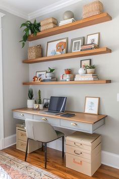 a desk with a laptop on top of it and some shelves above the desk in front of it