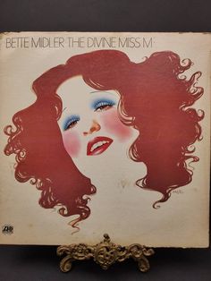 an old album cover with a woman's face on the front and back side