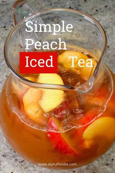 a pitcher filled with iced tea sitting on top of a table