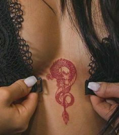 a woman with a tattoo on her stomach