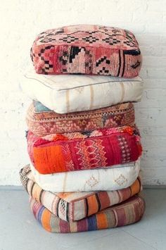 a stack of pillows sitting on top of each other