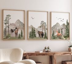 three paintings on the wall above a desk