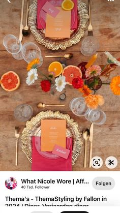 the table is set with pink and orange plates, silverware, and place settings