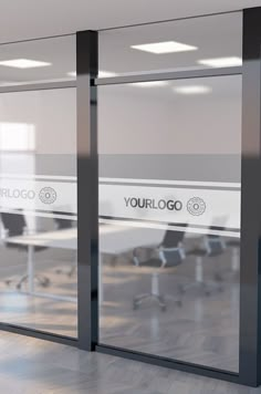 an empty conference room with glass walls and white desks in front of the doors