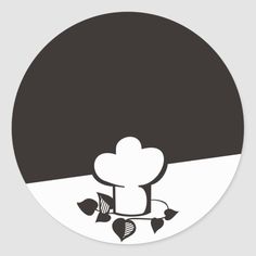 a black and white round sticker with a chef's hat on it