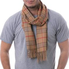 Felipe Berckholtz selects a warm shade of brown for the handsome design of this scarf. Intersecting bands of red dark brown and ivory create a harmonious contrast in a scarf woven of baby alpaca that is the wool from the season's first shear. It is renowned for its incredibly soft lightweight warmth. Winter Brown Alpaca Shawl, Alpaca Scarf Knitted Scarves For Men, Brown Alpaca Shawl, Handwoven Alpaca Scarves For Winter, Bohemian Handwoven Alpaca Scarves, Alpaca Scarf, Alpaca Yarn, Baby Alpaca, Alpaca Wool