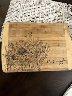 a cutting board with some flowers on it