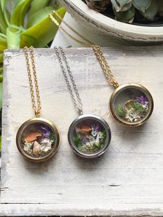 Handmade dried terrarium pendants using real mushrooms, flowers, moss and crystals!  Made using stainless steel pendants and come with a 16 inch stainless steel chain.  Progress shots and videos on my Instagram @art_from_the_meadow Real Mushrooms, Terrarium Jewelry, Terrarium Necklace, La Prairie, The Meadows, Stainless Steel Pendant, Instagram Art, Clothing Co, Ravens