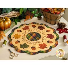 a table topped with lots of fall decorations