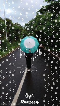 a person walking down the road with an umbrella