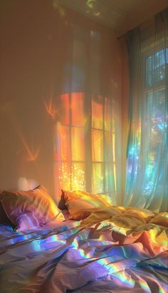 the sun shines brightly on a bed in front of a window