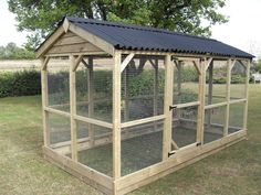 a chicken coop in the middle of a field