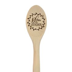 a wooden spoon with the words class is kitchen on it and a floral design in black ink