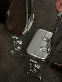 two pieces of luggage sitting next to each other