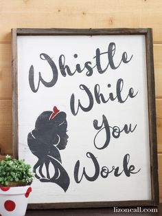 a sign that says, whistle while you work