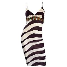 Amazing vintage GIANFRANCO FERRE (early 90s) brown and white abstract zebra printed rayon jersey BodyCon dress! Features incredible Amber and green crystal jewels below bust. Intricate stitching below bust. Hidden zipper up the side with hook-and-eye closure. Such a flattering little dress, that is a tru stunner on! Rare limited edition piece, that was made in Italy for the Japanese market only! Great for any day or evening event. Perfect with sandals, wedges, boots or heels. In great condition. Made in Italy. Marked Size EU 38 Measurements: (lots of stretch) 32-38 inch bust 26-30 inch waist 34-42 inch hips 41 inches from top shoulder to hem Green Velvet Gown, Brown Bodycon Dress, White Jersey Dress, Blue Knit Dress, Runway Gowns, White Vintage Dress, Designer Maxi Dress, Cocktail Dress Vintage, White Cocktail Dress