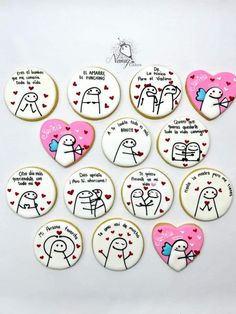 decorated cookies with different types of cartoon characters on them, arranged in the shape of hearts