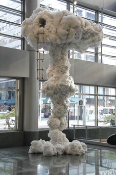 a large sculpture in the middle of a room filled with lots of white foams