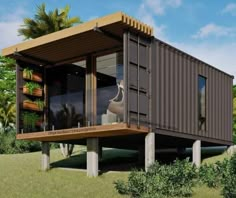 an artist's rendering of a house made out of shipping containers in the grass