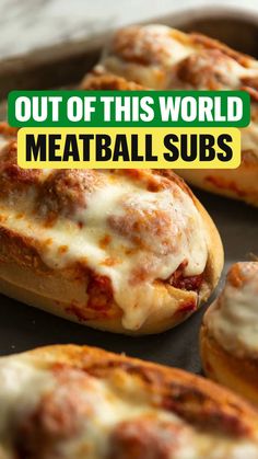 baked meatball subs on a baking sheet with the text out of this world meatball subs