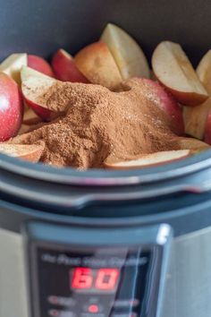 apples, cinnamon and powder in an instant pot on top of a digital kitchen scale