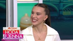 a woman sitting down with a bottle of liquid in front of her on the today show