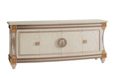 a white and gold chest with two doors