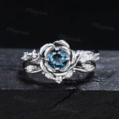 ● You will get high quality hand-made crafted jewelry when you purchase items on DRingstudio. The rare and treacherous greenish-blue hue of London blue topaz is often described as ink-like, making this gemstone one of the most popular engagement rings. It is known as the jewel of love and loyalty, representing everlasting love and friendship. If you are looking for a meaningful gift for coming special occasion, this jewelry might be the best pick for your loved one. ● Gems Info: Main stone: 5mm Round Natural London Blue Topaz Side stones: 1.5mm round and 1.5*3mm marquise Moissanite Matching band stones: Moissanite This ring can be customized by other gems stones, please contact us directly if you need :) ● Warranty 100 days warranty policy.  I always take responsibility for my customers. E Multi-stone Round Cut Topaz Ring Gift, Round Brilliant-cut Blue Topaz Birthstone Ring, Silver Blue Topaz Multi-stone Ring, London Blue Topaz Engagement Ring, Most Popular Engagement Rings, Blue Diamond-cut Topaz Ring In Sterling Silver, Silver Blue Topaz Gemstones, Round Shape, Popular Engagement Rings, Blue Topaz Engagement Ring