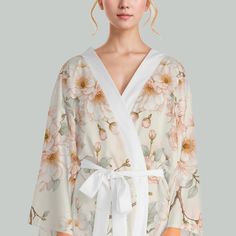 A beautiful kimono robe featuring sakura flowers, symbolizing renewal and the fleeting nature of life. This versatile robe can be worn at home or as a stylish party dress. Perfect for those who appreciate Japanese culture and want to bring a touch of springtime into their life. Ideal for special occasions, celebrations, or simply lounging in luxury. Product features - Kimono cut with long bell sleeves - Made of 100% durable polyester - Multifunctional use for various occasions - Easy care instru Cute Kimonos, Sakura Flowers, Kimono Floral, Beautiful Kimono, Beautiful Kimonos, Long Bell Sleeves, Stylish Party Dresses, Stylish Party, Floral Kimono