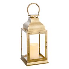 a gold metal lantern with a candle inside on a white background, it is isolated from the side