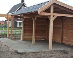 a small wooden building sitting on top of a dirt field