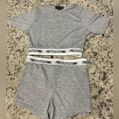 Pretty Little Thing Grey Tape Shorts Pajama Set, Size Xs. Cropped Tee And Matching Shorts Set With The “Prettylittlething” Tape Design. Brand New, With Tags, Never Worn. Primark Seamless Sets, Matching Pjs Friends Birthday, Baddie Pjs, Cute Pyjama Sets, Pretty Little Thing Set, Primark Pjs, Pj Romper, Pregnant Life, Lazy Fits