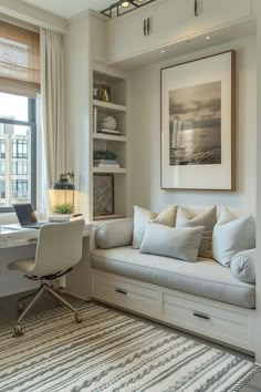 a living room filled with furniture and a large window next to a white desk topped with a laptop computer