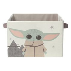 a toy storage box with an image of the child yoda on it and stars in the background