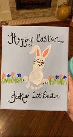 a person holding up a sign that says happy easter