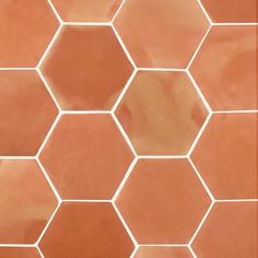 an orange tile with hexagonal tiles on it