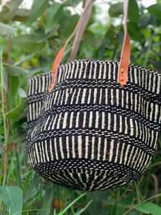 Summer handbags, Christmas Gift ,Summer handbags, Christmas GiftKiondo overview A of Sisal and wool with leather handles. Made of thick sisal fiber for firmness, beauty and durability. A Blue and Red shopping handbag made of sisal  and wool with leather handles. The bag is made of sisal fiber that is hand picked hand prepared into yearn then twisted and weaved together with recycked wool . It is finished with natural leather mainly from cow hide. Uses The bag is extra large in size that can acco Natural Top Handle Bucket Bag For Market, Top Handle Natural Bucket Bag For Market, Black Bucket Straw Bag, Black Bucket Straw Bag With Handles, Black Large Capacity Shoulder Bag For Market, Black Bags For Market, Bucket Woven Bags For Shopping, Bucket Shaped Woven Bags For Shopping, Large Capacity Black Bag For Market