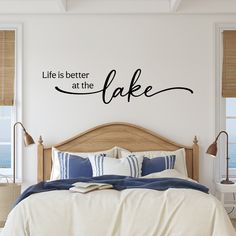 a bedroom wall decal with the words life is better at the lake